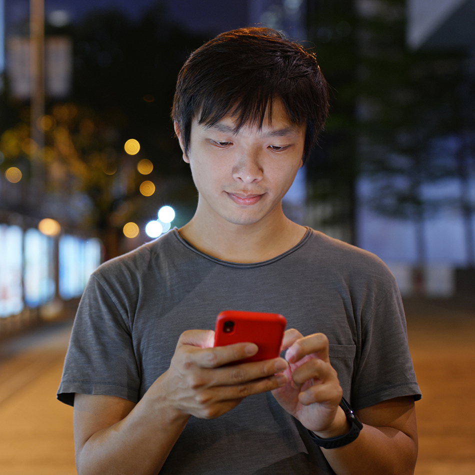 Young man looking at his phone