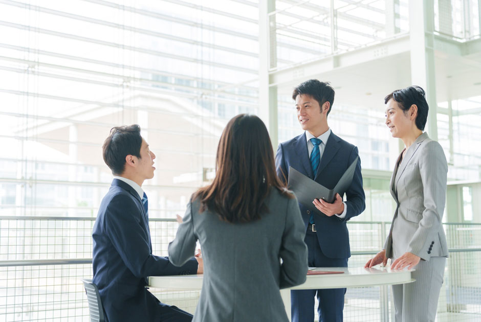 A group of colleagues in Japan work on a project together