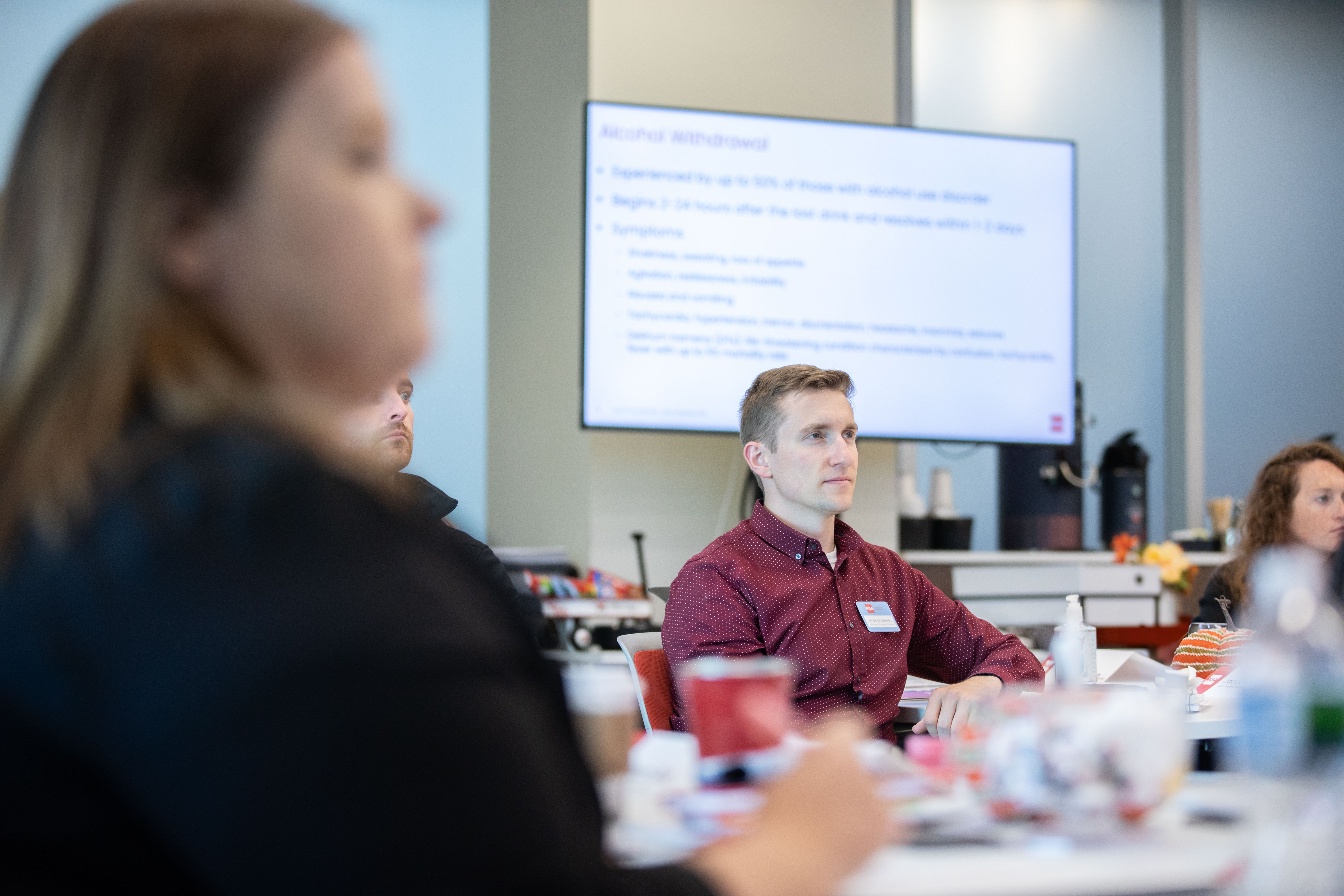 Participants from major insurers at RGA's Underwriting University gaze intently at a presentation