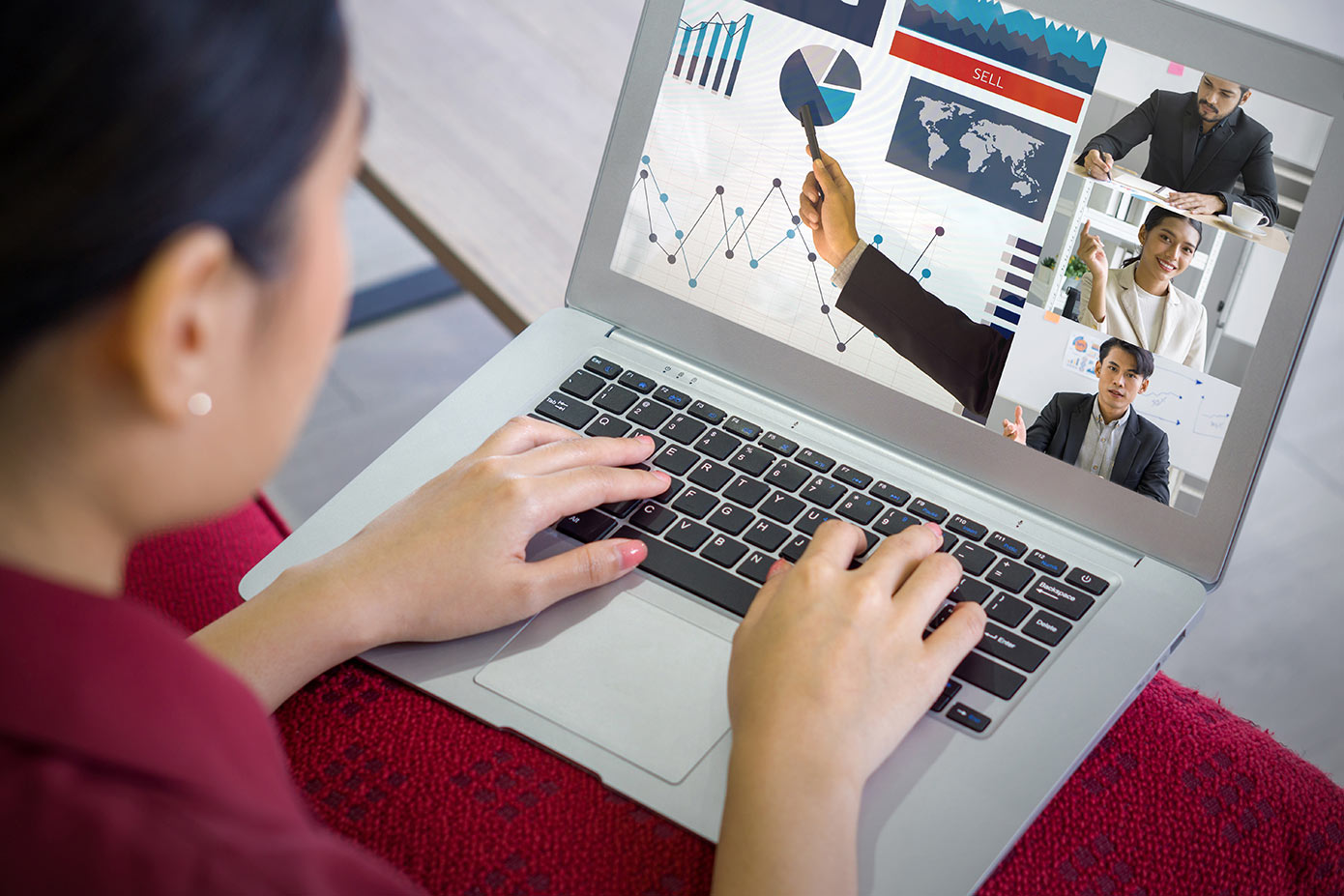 Woman watching a webinar on a laptop