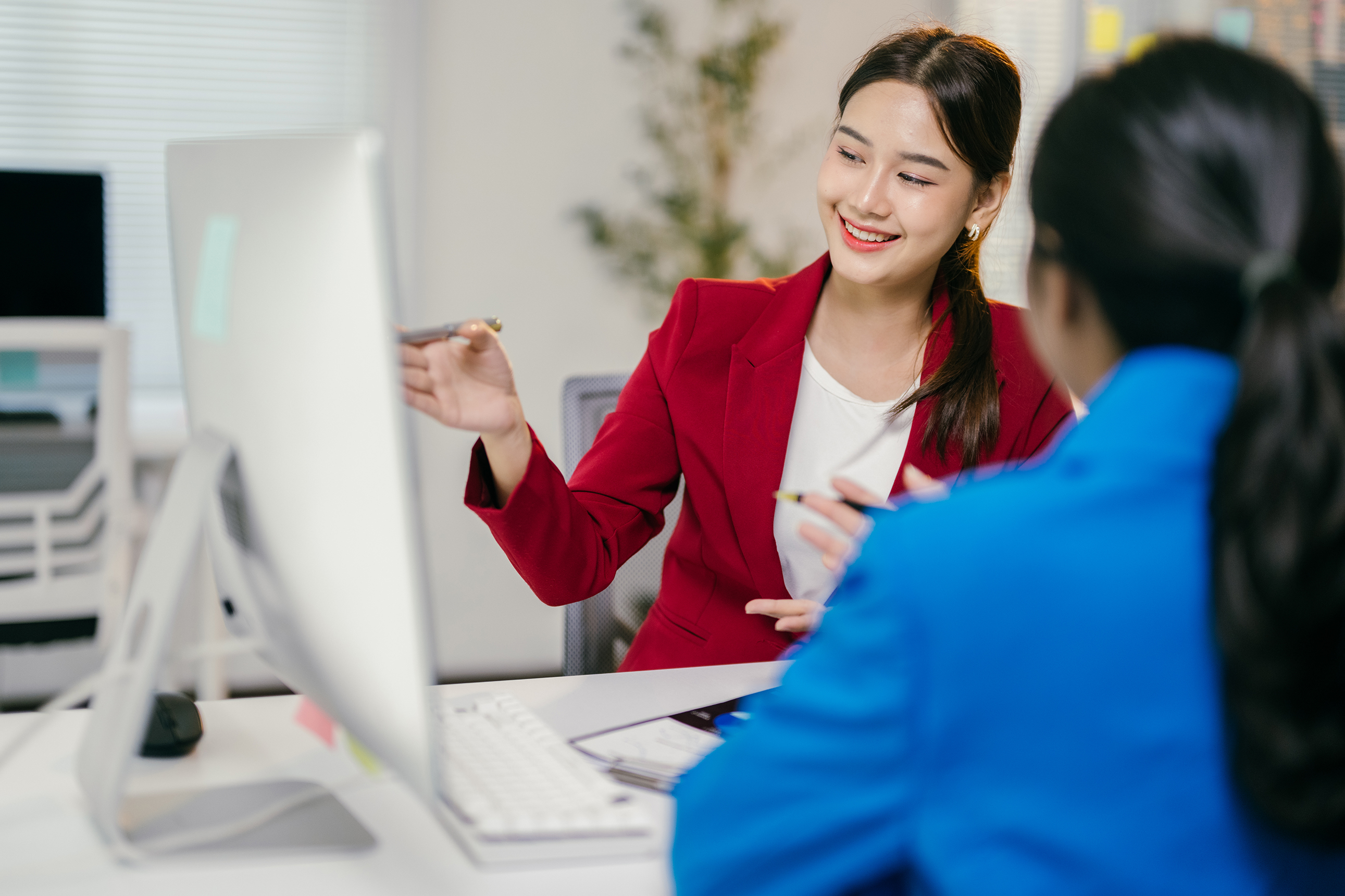 Woman talking with a woman about insurance