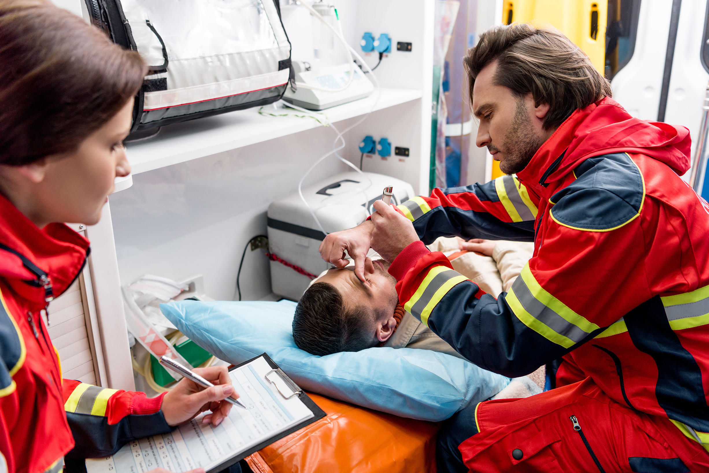 Ambulance EMTs working on patient
