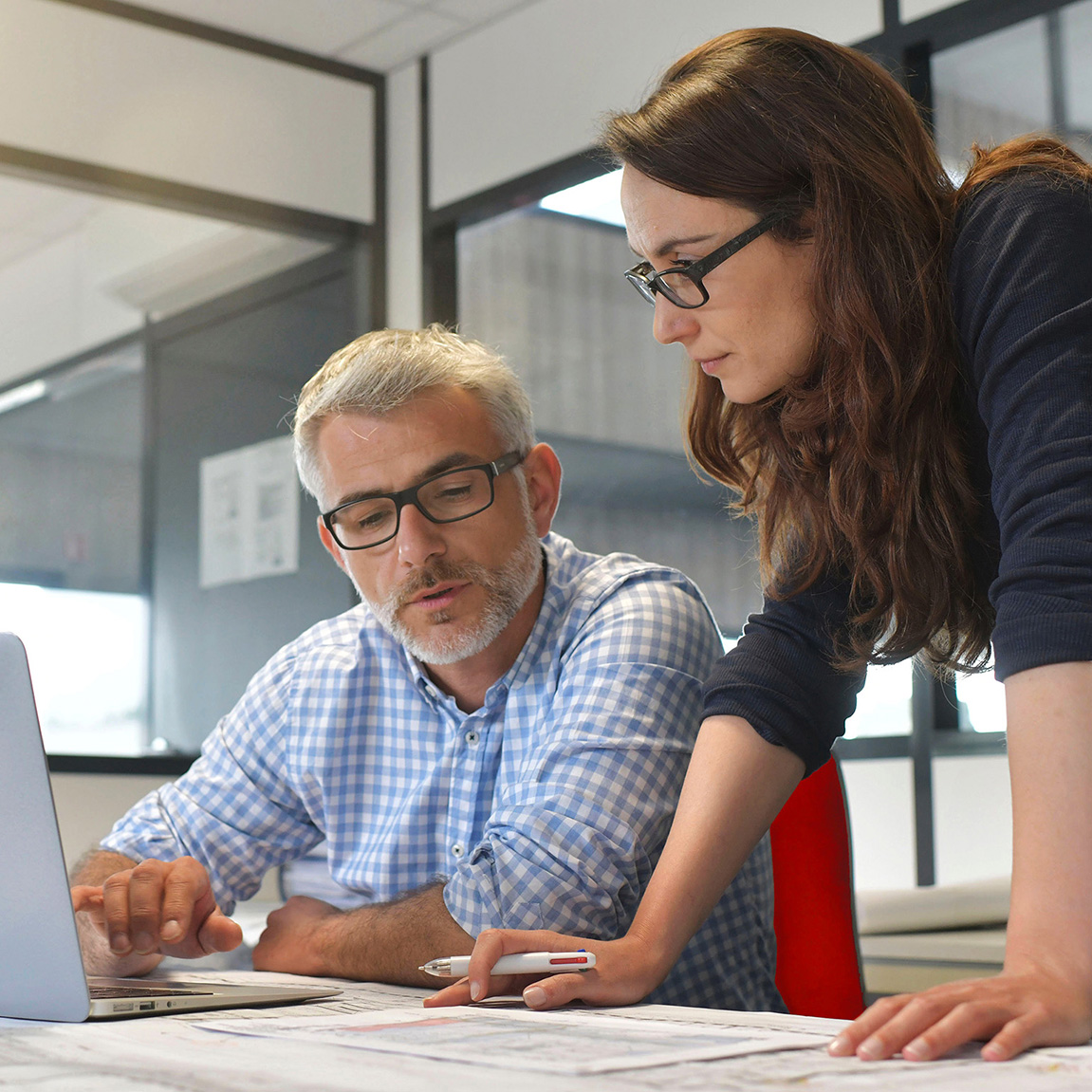 Man and women looking over insurance information