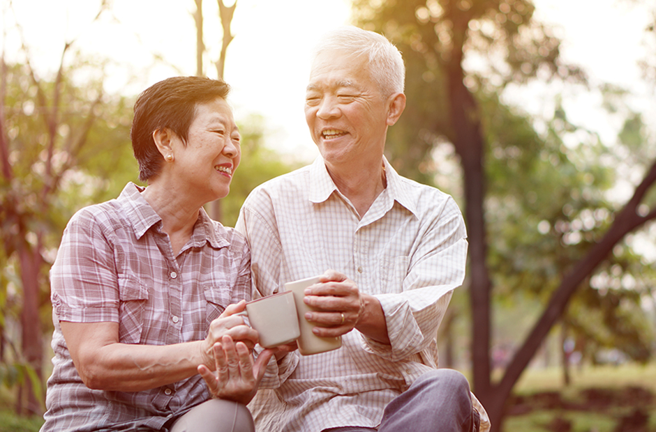 Elderly couple from Asia enjoys tea